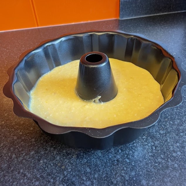 Raw cake mix in Bundt cake tin