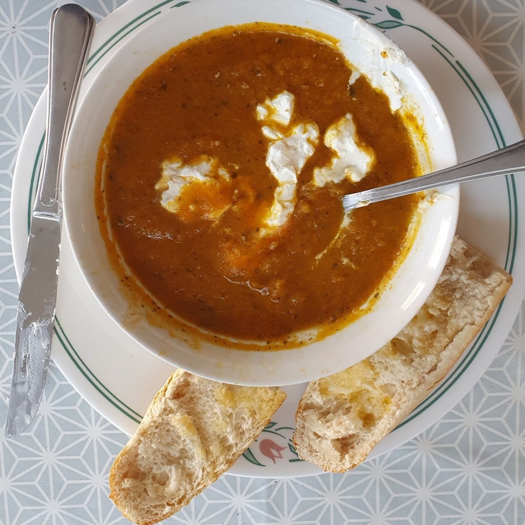Carrot soup with sour cream and bagette